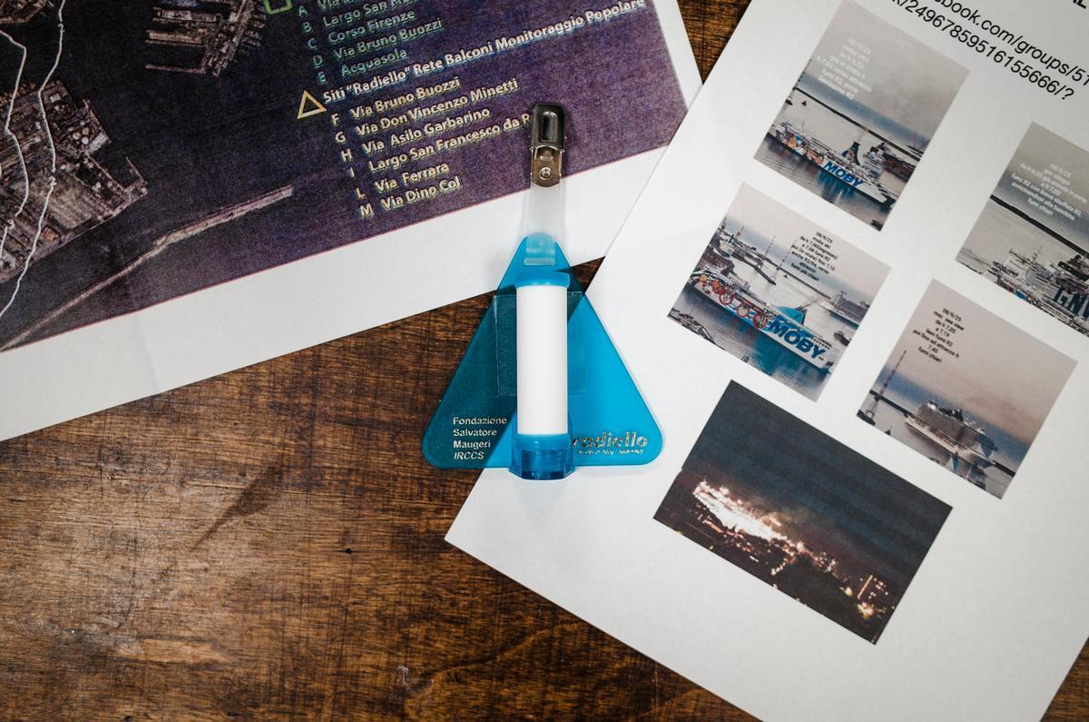 A device used by citizens in Genoa (Italy) to measure air pollution, alongside pictures documenting fumes from ships. Photo by Paolo Valenti