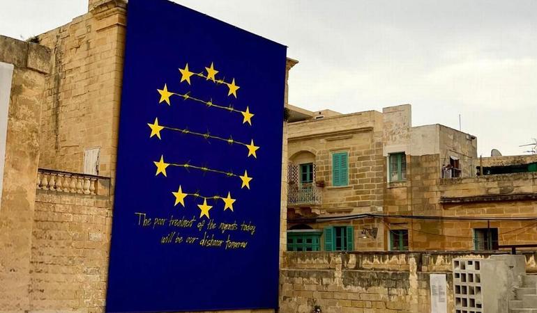 "The poor treatment of migrants today will be our dishonor tomorrow". Mural by Cuban artist Tania Bruguera in Malta. Photo by Clelia Vettori