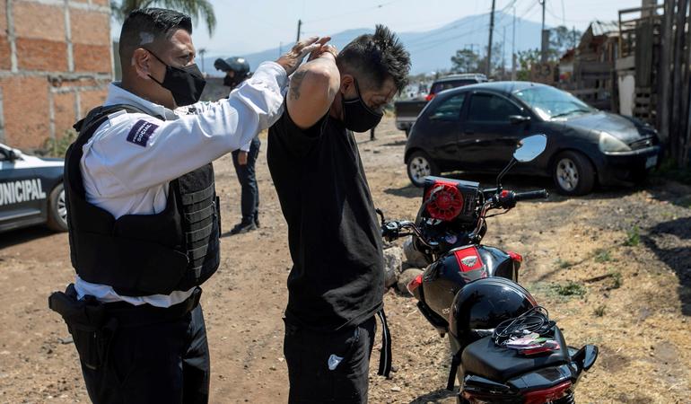 Morelia, Michoacan (Mexico), 04 May 2021. A man is searched for weapons in a police surveillance operation. Clashes between at least nine drug cartels have plunged the State of Michoacán into a serious crisis (Ivan Villanueva/Epa)